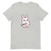 Sword-Wielding Bunny Tee, front view — chubby kawaii pink bunny holding a sword, big sparkly eyes, pastel colors, white