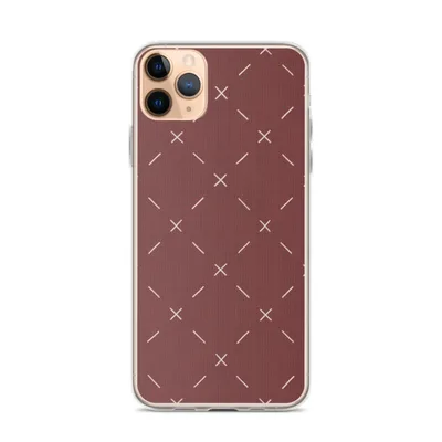 repeating white cross stitch X marks and diagonal dashes arranged in a grid on a deep burgundy red textured background on mockup Crimson Cross Stitch Clear Case - default view — clear iphone case