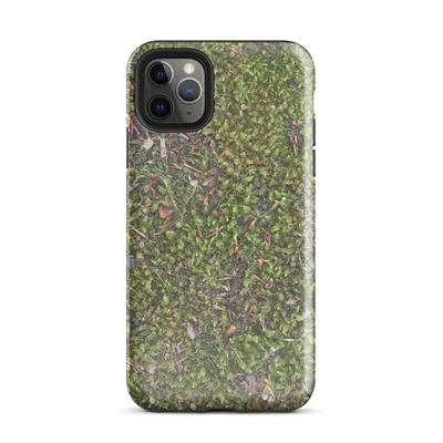 aerial close-up photograph of vivid green moss covering forest ground with scattered pine needles, bark chips, and small stones in earthy tones on Glossy Forest Floor Moss Texture Case - default view — protective iphone case