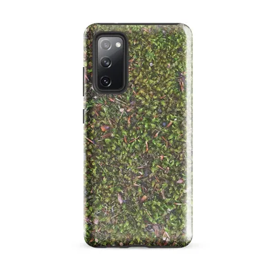 top-down view of dense green moss covered with scattered pine needles, small pebbles, and reddish-brown leaf fragments in natural forest tones on Glossy Forest Floor Moss Tough Case for Samsung - default - Front view — samsung phone case