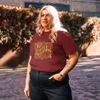 Burgundy Not Inevitable Peace Retro Tee, front view — bold 70s psychedelic lettering reading Not Inevitable with a peace