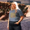 Dark Heather Blue Not Inevitable Peace Retro Tee, front view — bold 70s psychedelic lettering reading Not Inevitable