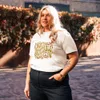 White Not Inevitable Peace Retro Tee, front view — bold 70s psychedelic lettering reading Not Inevitable with a peace