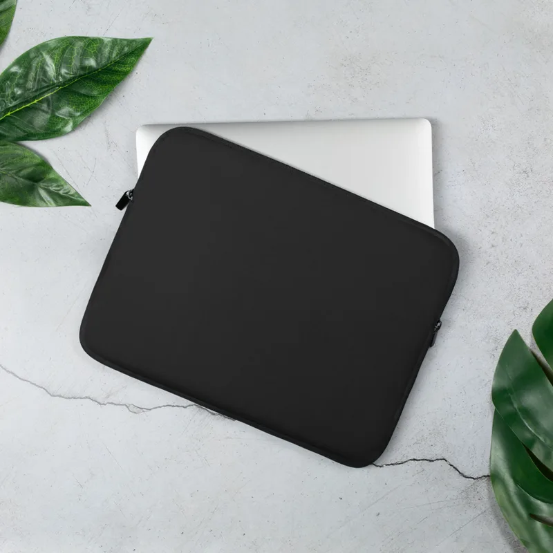 Midnight Black Essential Laptop Sleeve — solid matte black surface with subtle dark tonal variation on a clean, unadorned