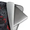 Dark Circuit Breach Laptop Sleeve — densely packed dark grey circuit board panels and mechanical hardware with glowing red