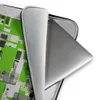 Circuit City Grid Laptop Sleeve — aerial view of a futuristic city rendered as dense circuit board grids in lime green