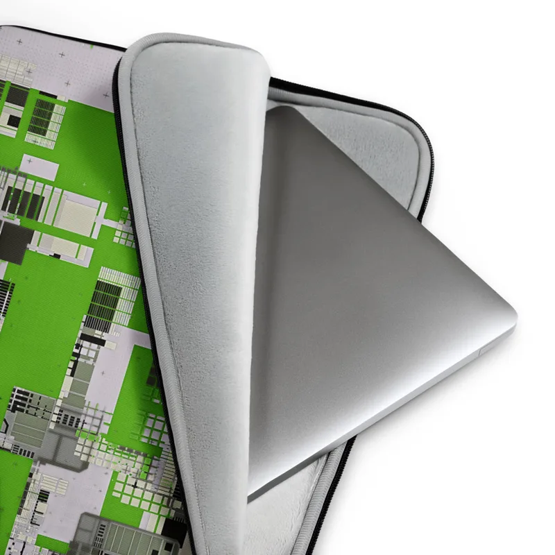 Circuit City Grid Laptop Sleeve — aerial view of a futuristic city rendered as dense circuit board grids in lime green
