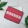 Red Star Band Laptop Sleeve — seven dark red stars aligned on a soft pink horizontal band over a solid crimson-red