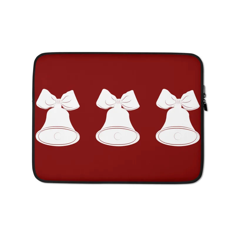 Triple Bell Holiday Laptop Sleeve — three white Christmas bells with ribbon bows arranged in a row on a deep red background