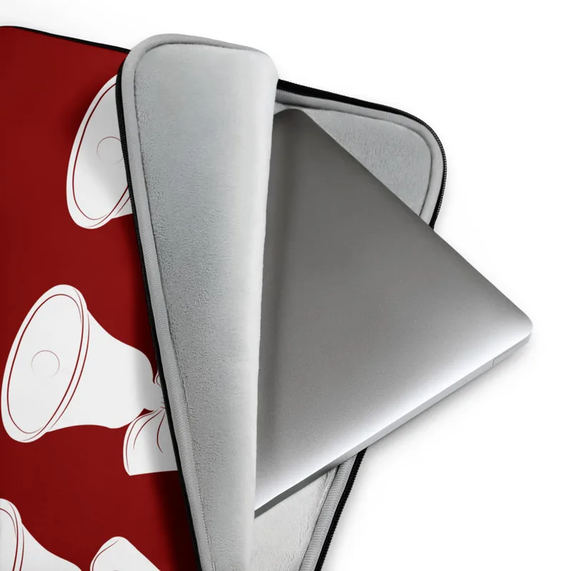 Triple Bell Holiday Laptop Sleeve — three white Christmas bells with ribbon bows arranged in a row on a deep red background