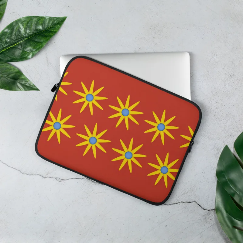 Solar Burst Crimson Laptop Sleeve — repeating golden eight-petal sunburst flowers with blue centers arranged in rows