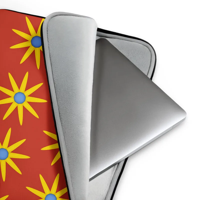 Solar Burst Crimson Laptop Sleeve — repeating golden eight-petal sunburst flowers with blue centers arranged in rows