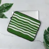 Green Wave Ripple Laptop Sleeve — flowing white horizontal wavy stripes repeating across a deep forest green background