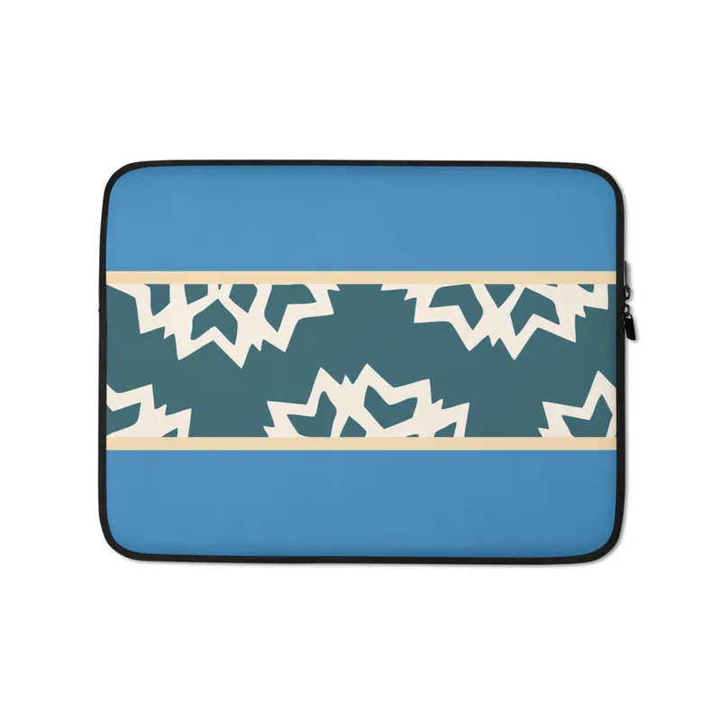 Arctic Fracture Laptop Sleeve — jagged cracked ice shards in cream white on deep teal horizontal band, framed by sand