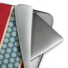 Crimson Band Snowflake Laptop Sleeve — deep red background with a horizontal teal band bordered in cream, filled