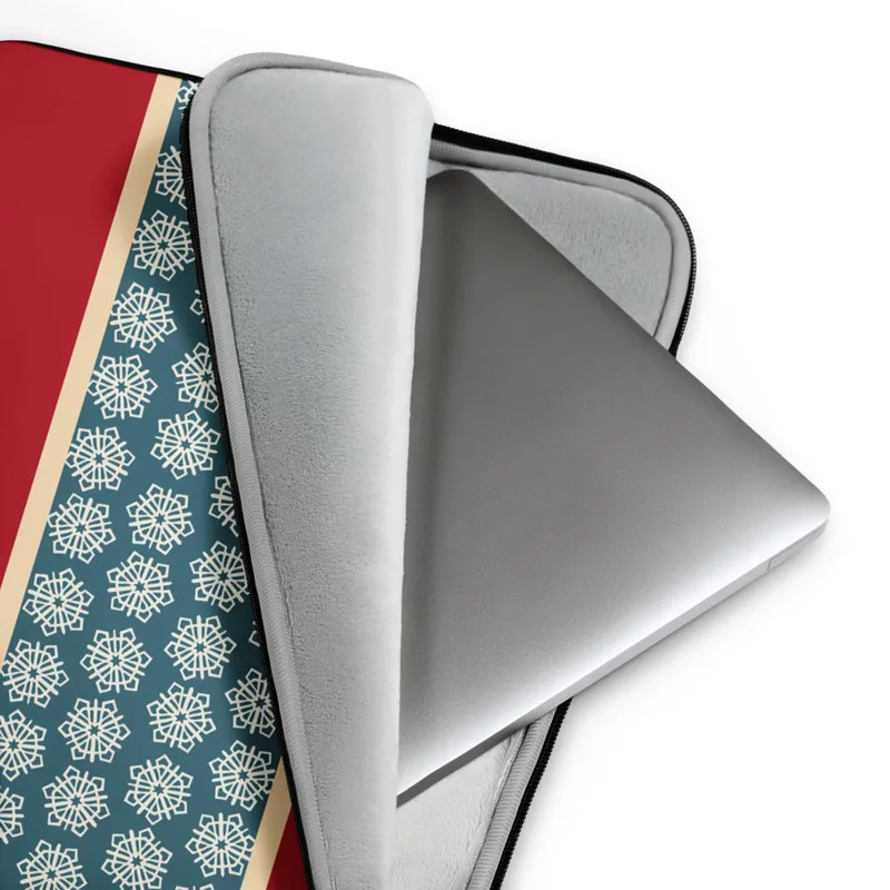 Crimson Band Snowflake Laptop Sleeve — deep red background with a horizontal teal band bordered in cream, filled