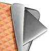 Warm Geometry Laptop Sleeve — tessellating triangles in coral red, golden yellow, and soft peach with a blurred vignette