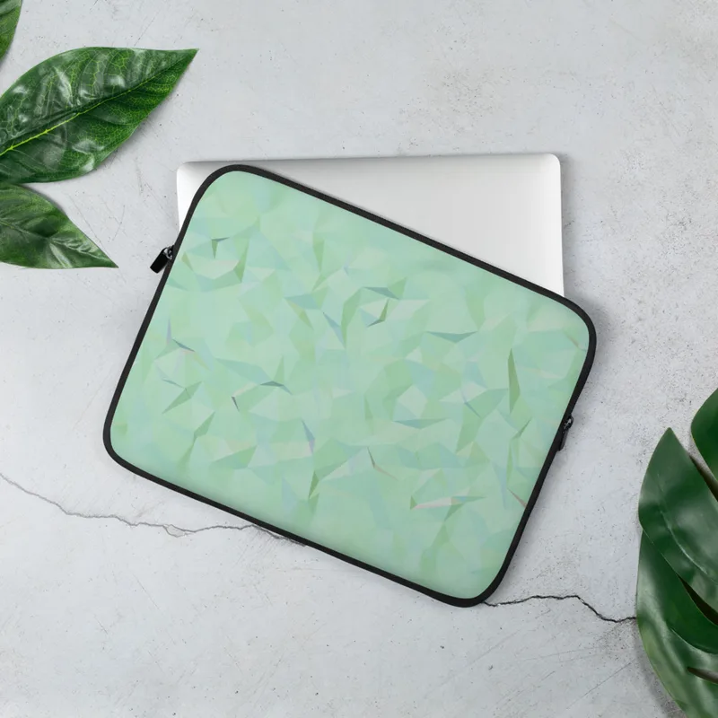 Mint Crystal Geometry Laptop Sleeve — low-poly crystal pattern of soft mint, aqua, and pearl triangles forming a faceted