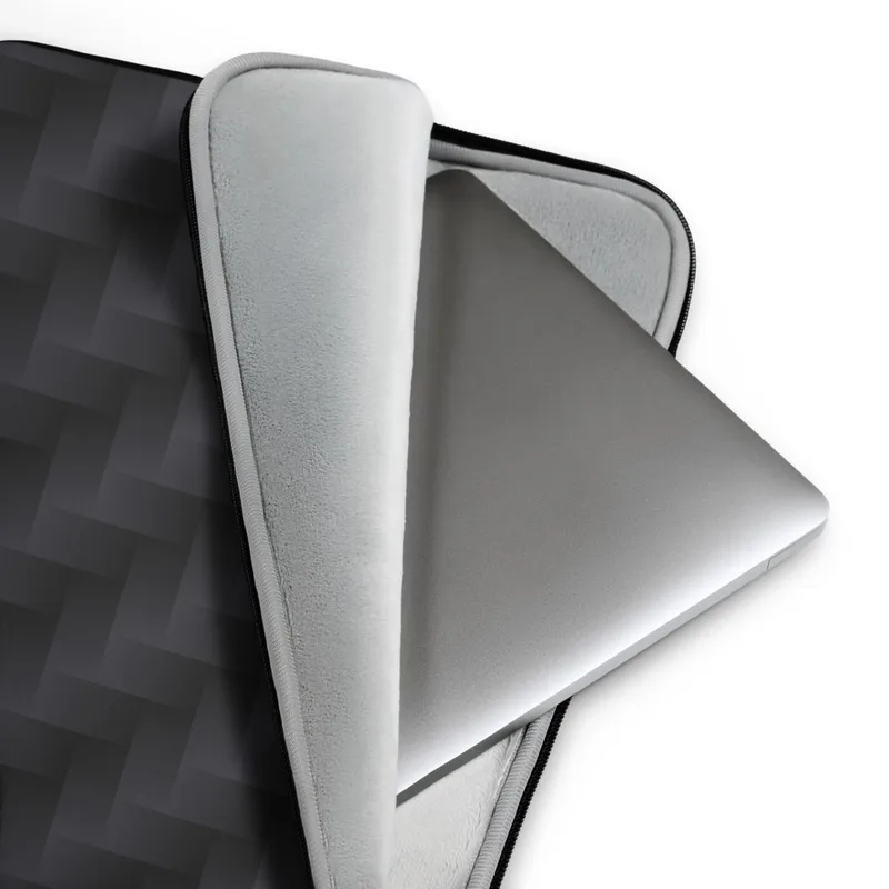 Carbon Weave Shadow Laptop Sleeve — seamless woven carbon fiber pattern with interlocking diagonal bands in deep charcoal