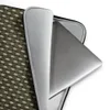 Tactical Weave Laptop Sleeve — tightly woven basket-weave pattern in dark olive green and warm khaki with interlocking fiber