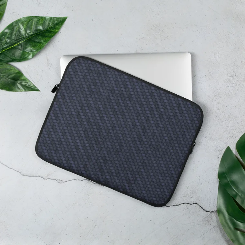 Midnight Carbon Fiber Laptop Sleeve — navy blue carbon fiber twill weave pattern with diagonal light-reflecting bands