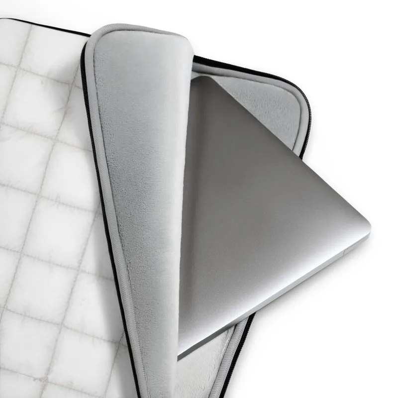 Cloud White Quilted Laptop Sleeve — soft white quilted grid pattern with subtle stitched seams and a plush pillow-like