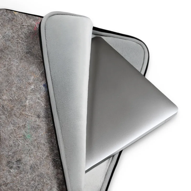 Urban Felt Grey Laptop Sleeve — close-up photograph of grey industrial felt with tangled fibers and scattered colorful