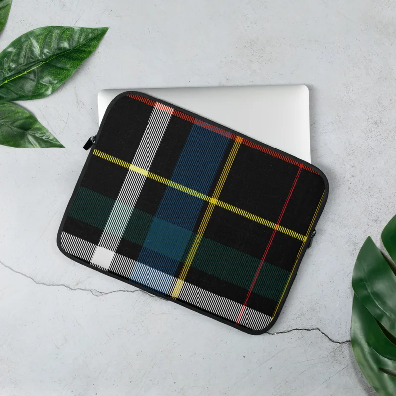 Highland Spirit Tartan Laptop Sleeve — classic Scottish tartan plaid with black background and bold crossing stripes