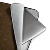 Cracked Earth Brown Terrain Laptop Sleeve — dark brown cracked earth surface with fine lighter brown fissure lines forming