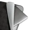 Dark Stone Grid Laptop Sleeve — repeating grid of dark charcoal octagonal tiles with small diamond-shaped intersections