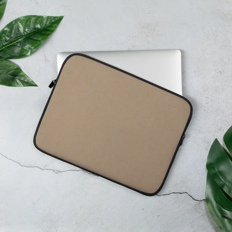 Warm Sand Minimal Laptop Sleeve — smooth warm sandy beige surface with a faint scattered speckle texture in a soft matte