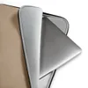 Warm Sand Minimal Laptop Sleeve — smooth warm sandy beige surface with a faint scattered speckle texture in a soft matte