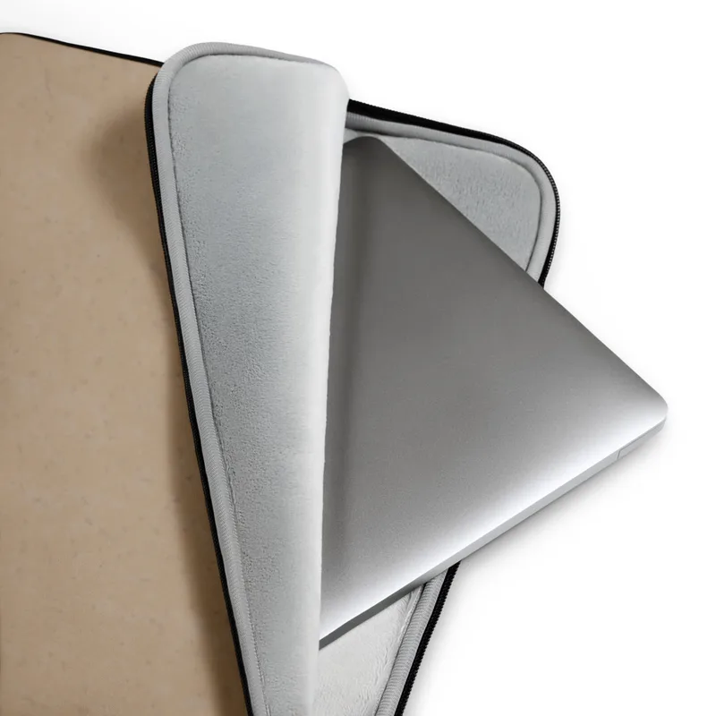 Warm Sand Minimal Laptop Sleeve — smooth warm sandy beige surface with a faint scattered speckle texture in a soft matte