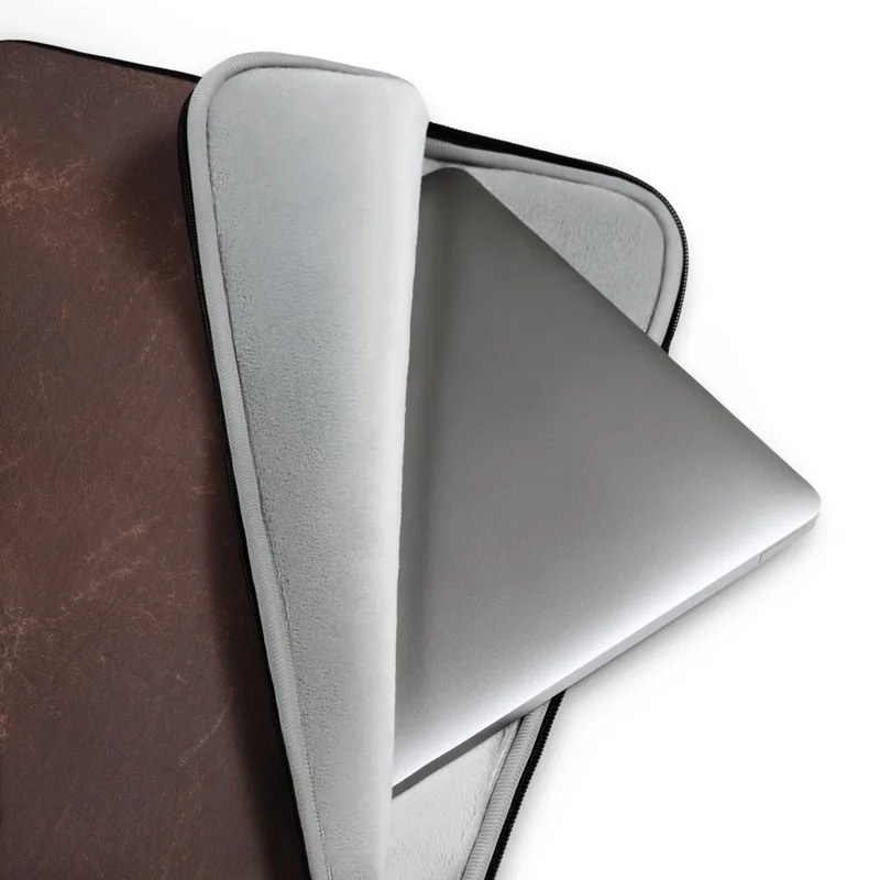 Copper Vintage Distressed Leather Laptop Sleeve — close-up of aged dark brown leather with natural creasing and copper-toned