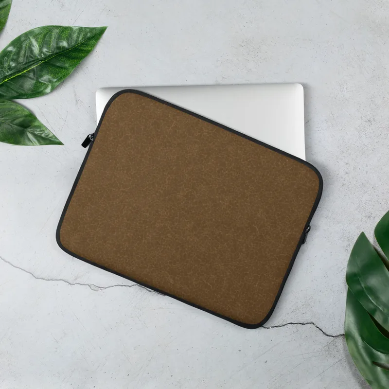Aged Leather Terrain Laptop Sleeve — close-up crackle pattern resembling aged cognac leather with fine tonal brown fissures