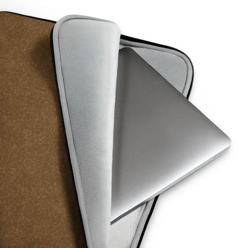 Aged Leather Terrain Laptop Sleeve — close-up crackle pattern resembling aged cognac leather with fine tonal brown fissures