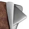 Vintage Worn Leather Laptop Sleeve — aged leather surface with cracked mahogany and warm caramel tones forming a dense web