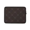 Leather Dark Diamond Quilted Laptop Sleeve — diagonal double-stitched diamond grid pattern in silver-grey lines on a deep