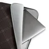 Leather Dark Diamond Quilted Laptop Sleeve — diagonal double-stitched diamond grid pattern in silver-grey lines on a deep
