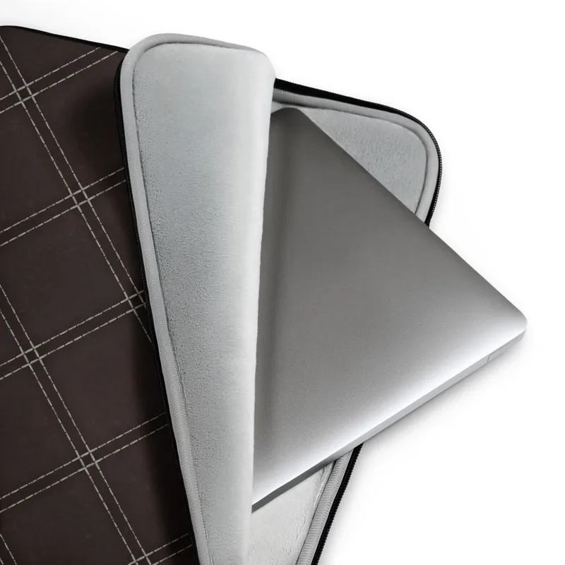 Leather Dark Diamond Quilted Laptop Sleeve — diagonal double-stitched diamond grid pattern in silver-grey lines on a deep