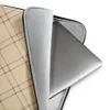 Classic Plaid Lattice Laptop Sleeve — diagonal lattice plaid pattern with fine dark lines crossing over warm sand and cream