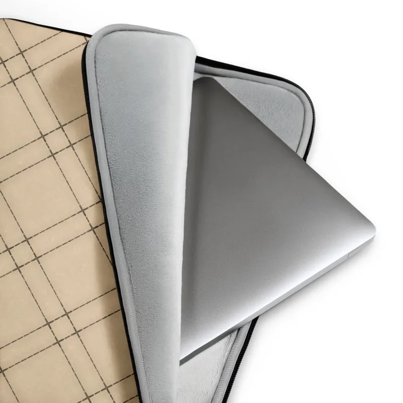 Classic Plaid Lattice Laptop Sleeve — diagonal lattice plaid pattern with fine dark lines crossing over warm sand and cream