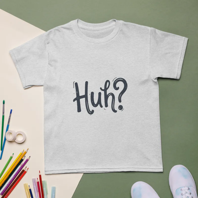 Ash Huh? Say That Again, front view — bold hand-lettered word Huh followed by a question mark in dark navy blue on a warm