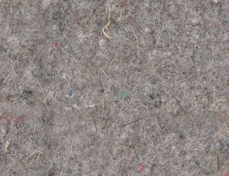 Urban Felt Grey Laptop Sleeve design — close-up photograph of grey industrial felt with tangled fibers and scattered